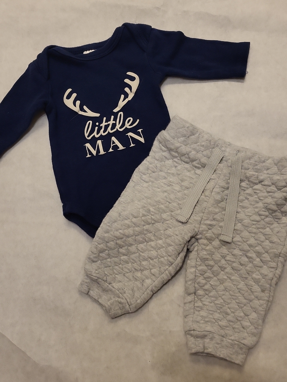 "Little Man" navy long sleeve bodysuit with light grey quilted pants
